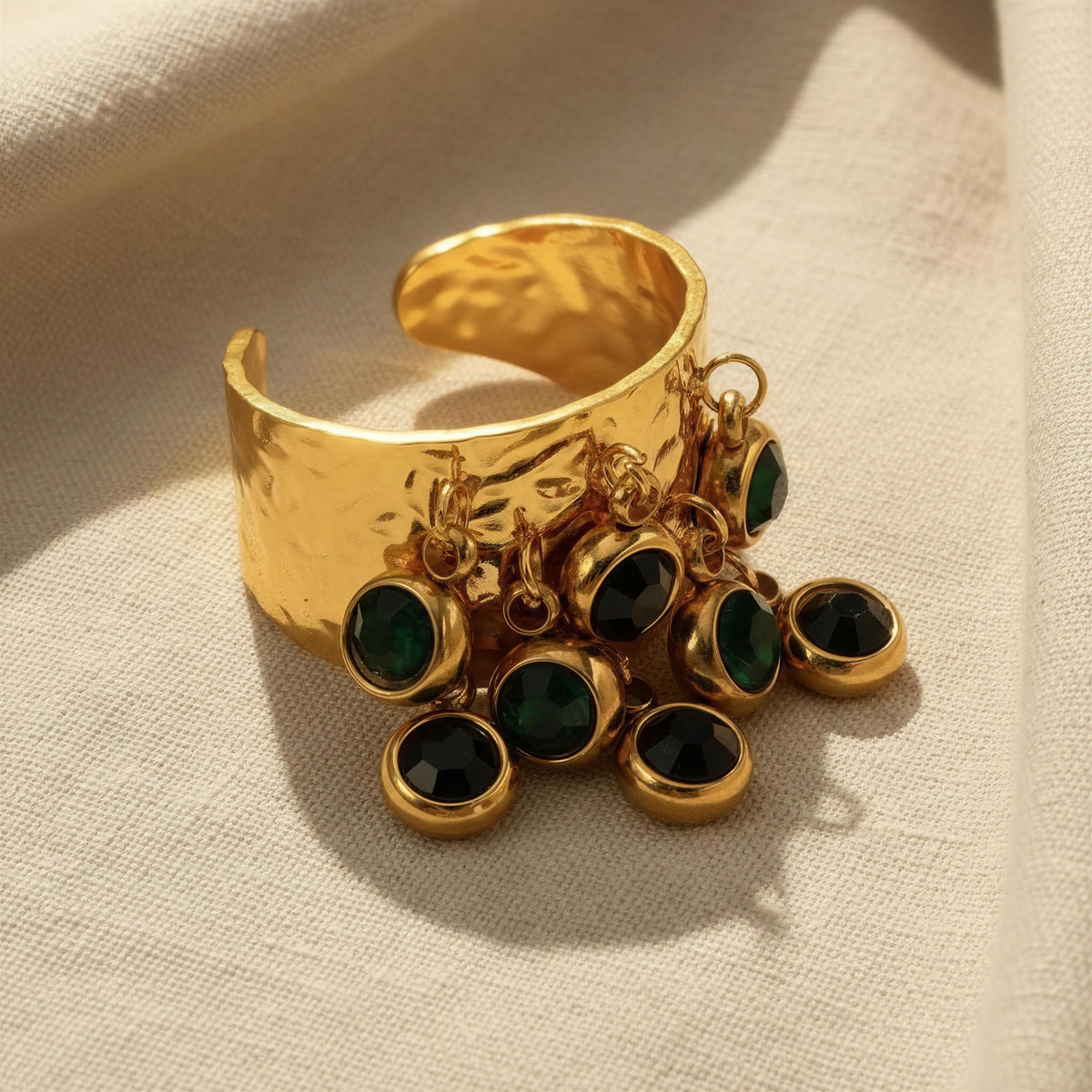 The Alara Ring from Chica Chica Jewelry
against a beige linen fabric.