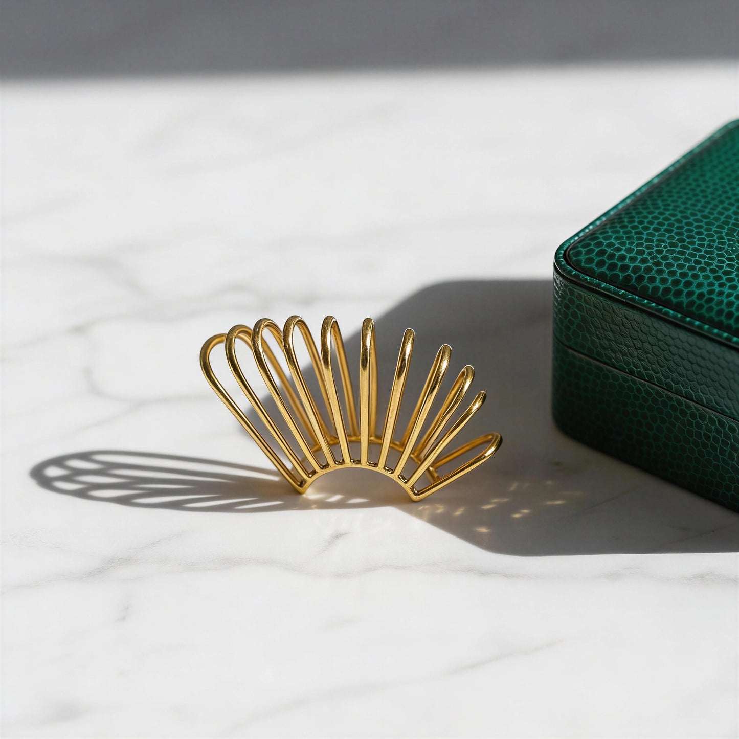 Golden Horizon Ear Cuff with a shagreen jewelry case in the background