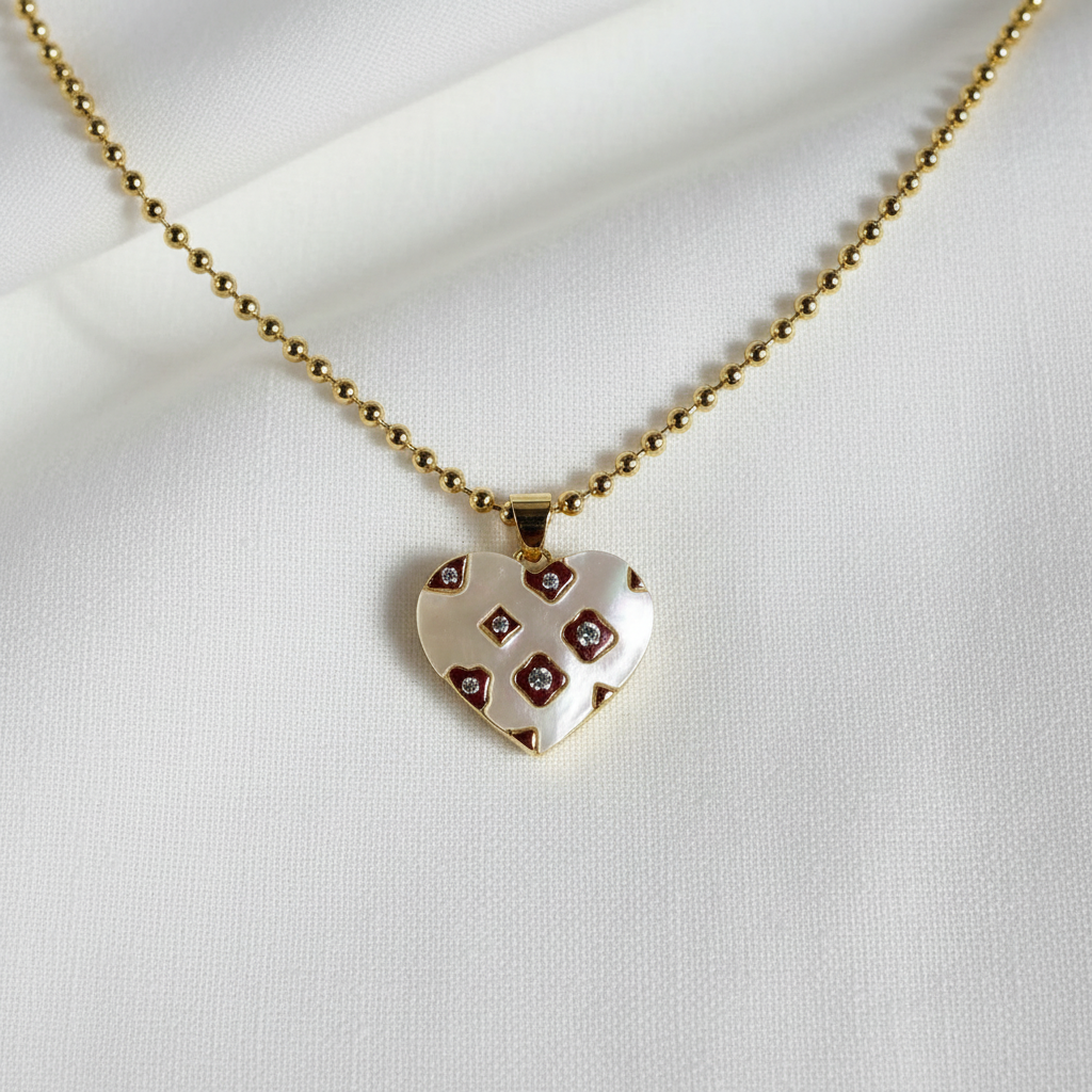 The Amore Mosaico Heart Necklace-shaped pendant necklace with gold chain on a white background