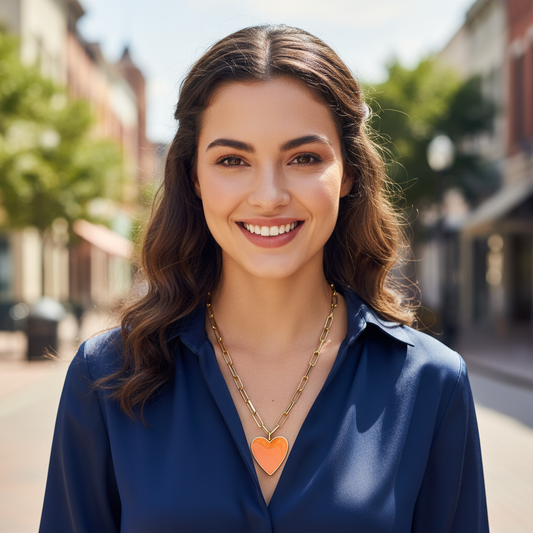 Woman wearing a blue shirt and heart-shaped necklace on a street background