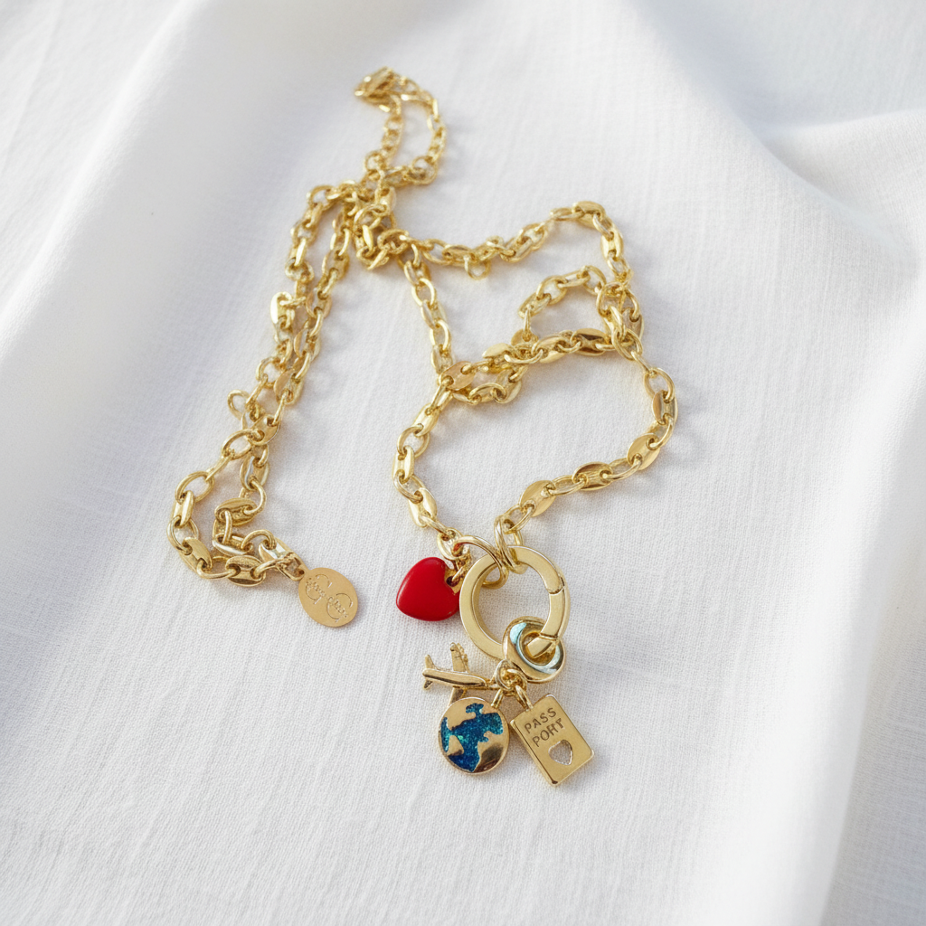 Gold bracelet with charms on a white background