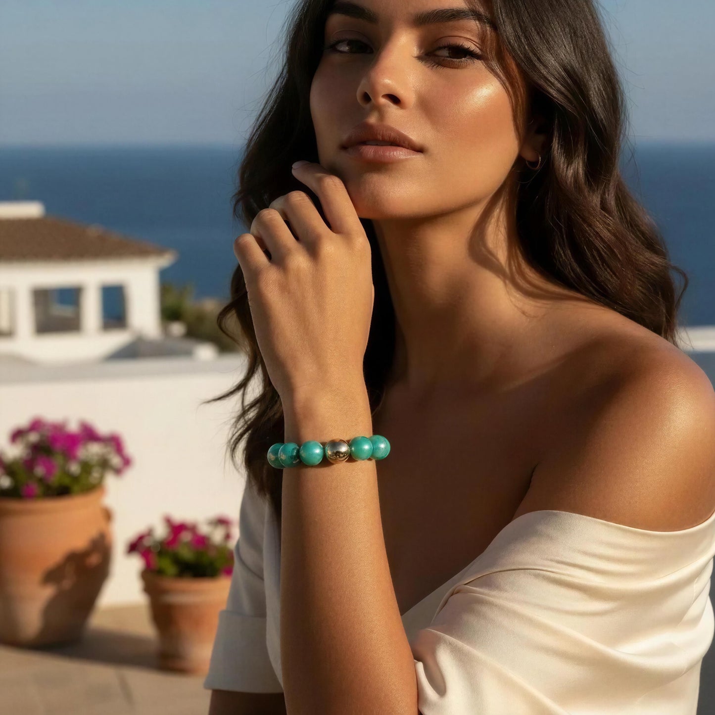 Woman wearing the Aquamarine Glow Bracelet with a scenic background