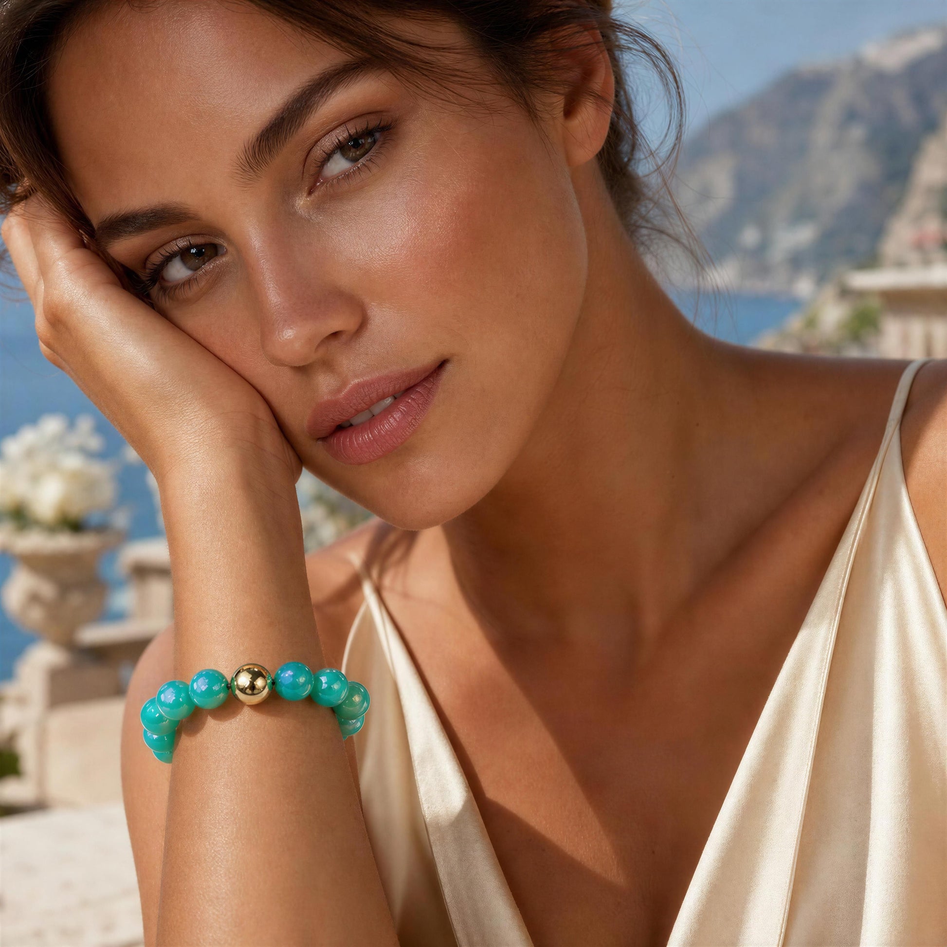 Woman wearing a turquoise bracelet with a scenic background