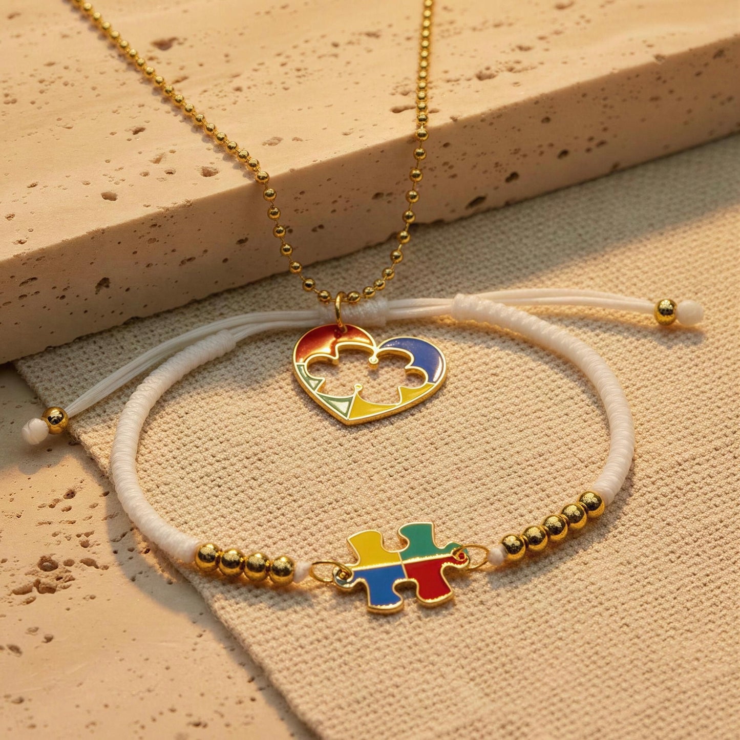 The Autism Connection Heart Set – White Cord Edition on beige fabric 