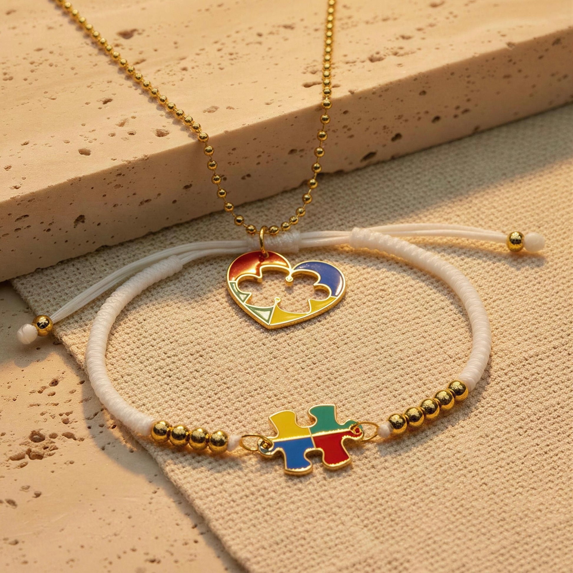 The Autism Connection Heart Set – White Cord Edition on beige fabric 