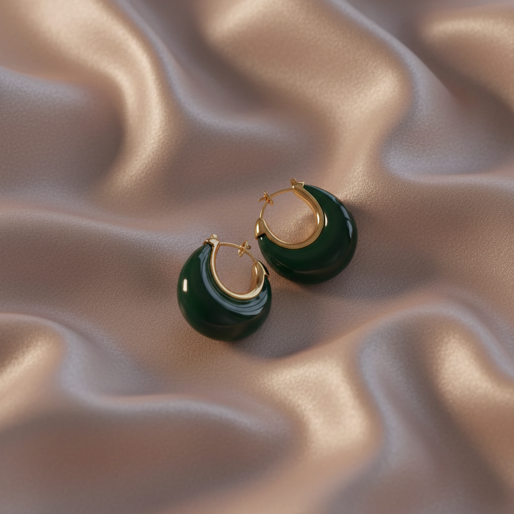 Ava Hoops - Emerald Green earrings  on a beige fabric background