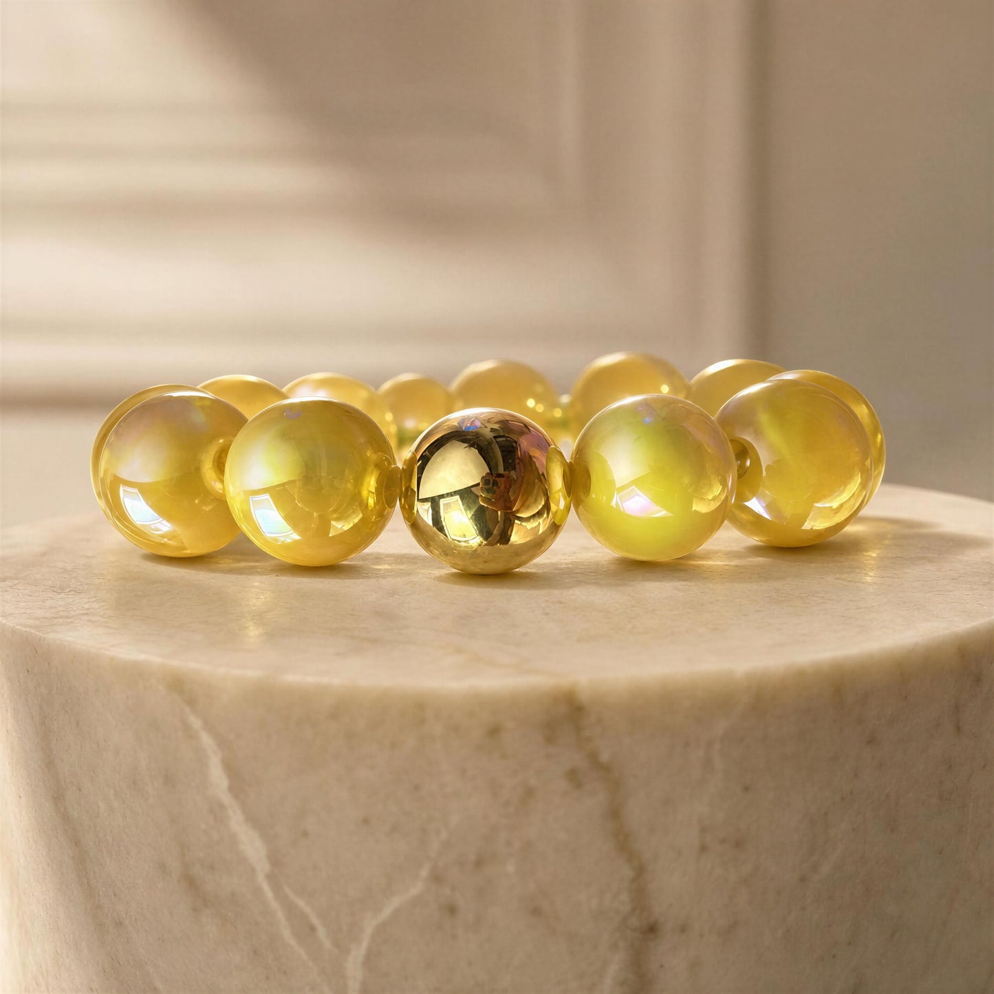The Banana Glow Bracelet on a marble surface with a neutral background