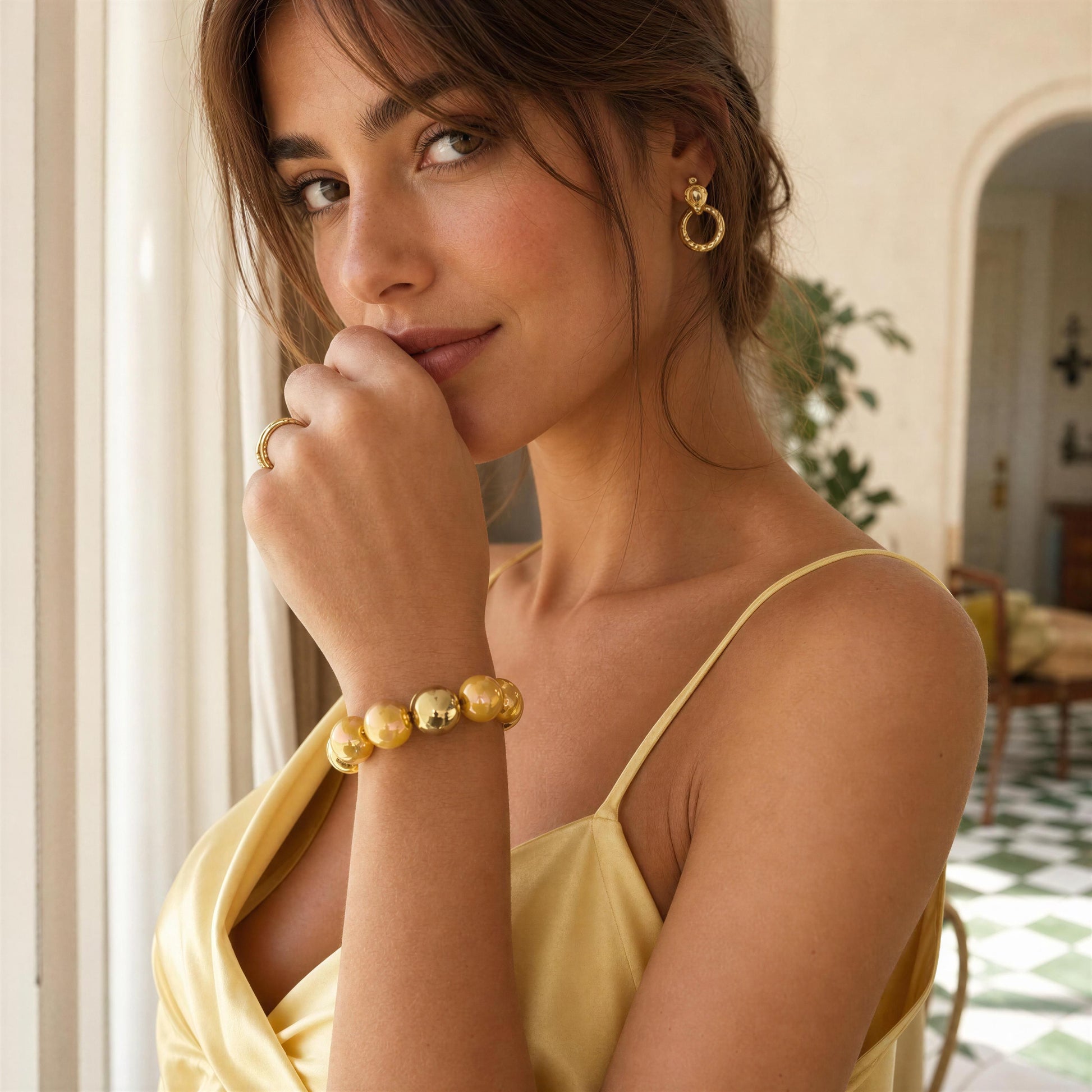 Model wearing the Banana Glow Bracelet from Chica Chica Jewelry