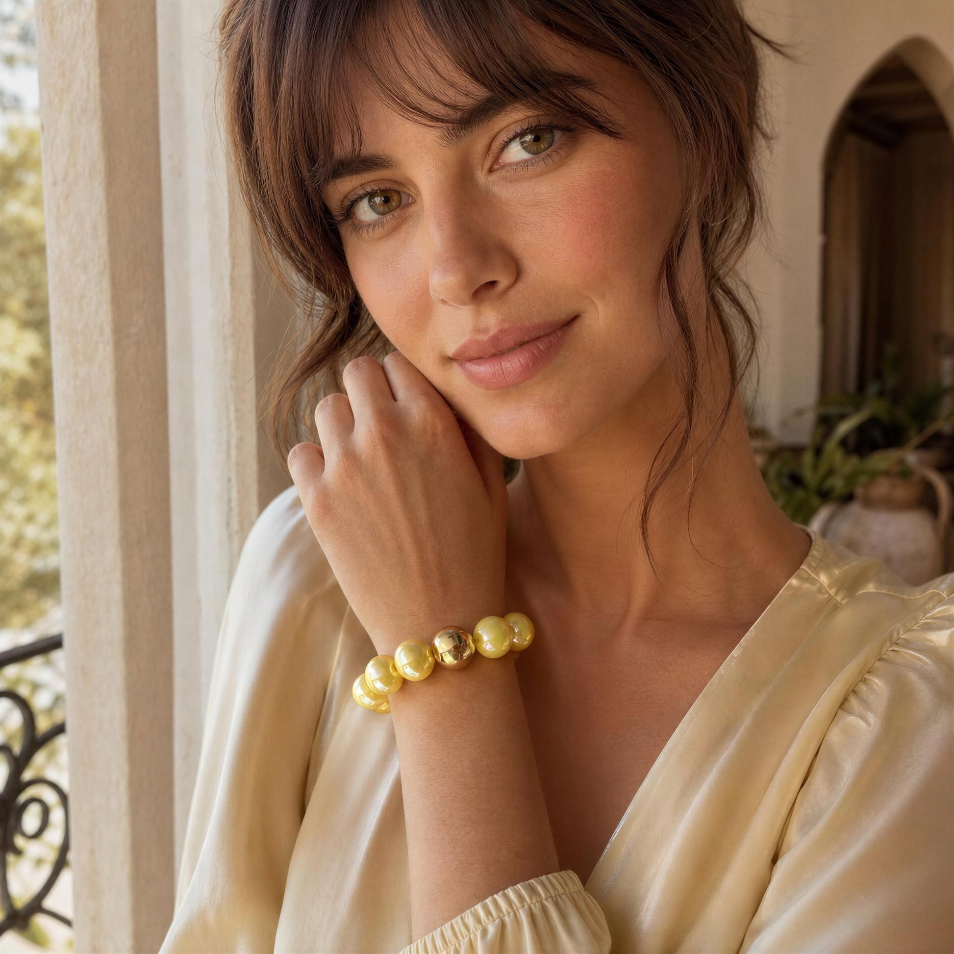 Model wearing the Banana Glow Bracelet on indoor Mediterranean indoors