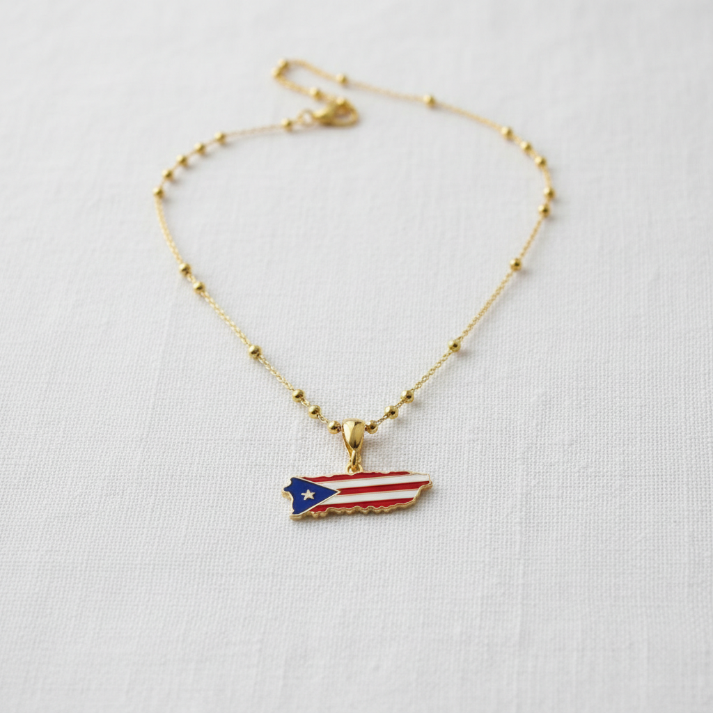 Borinquen Flag Necklace from Chica Chica Jewelry with a Puerto Rican flag pendant on a white background