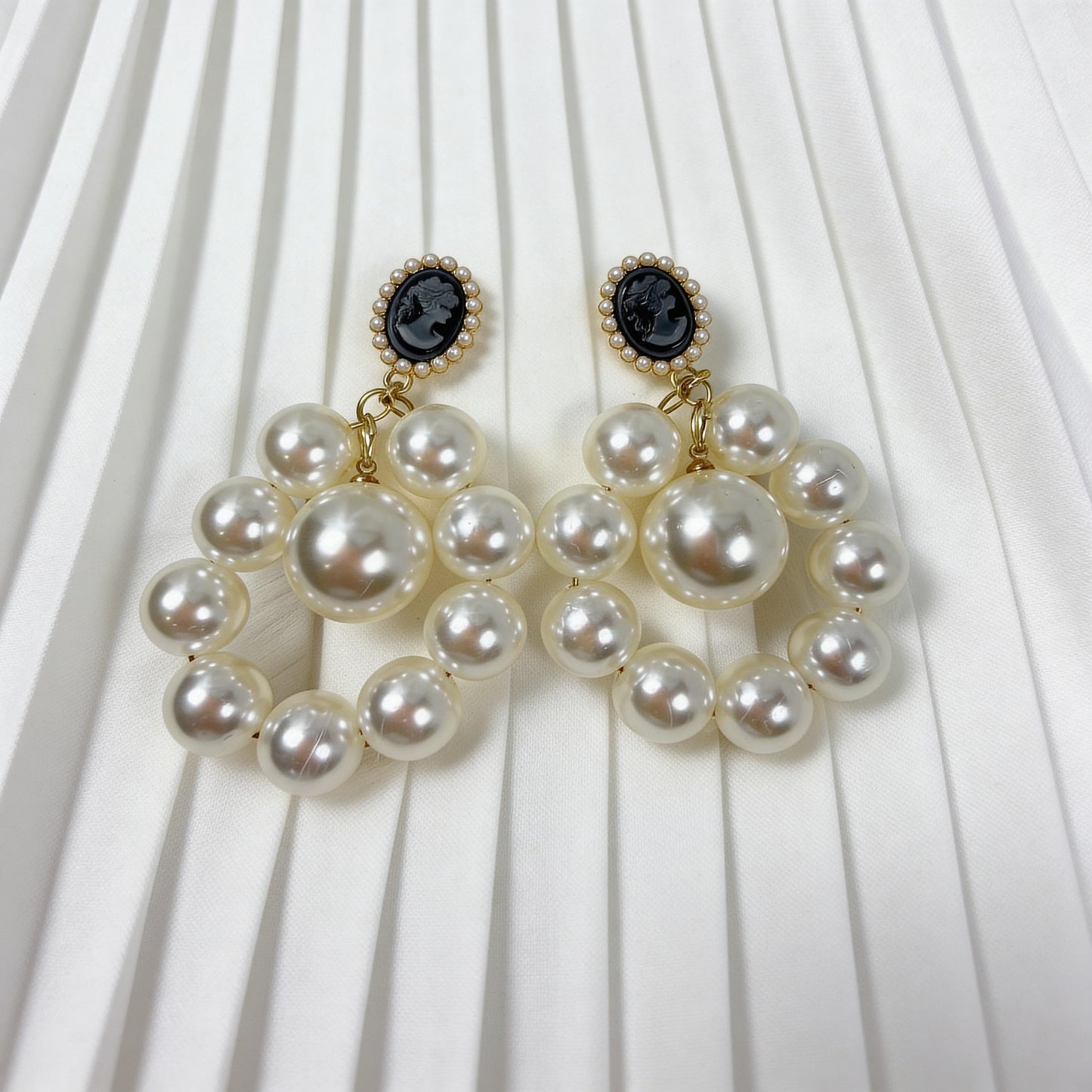 The Regal Cameo Pearl Statement Earrings on a white background