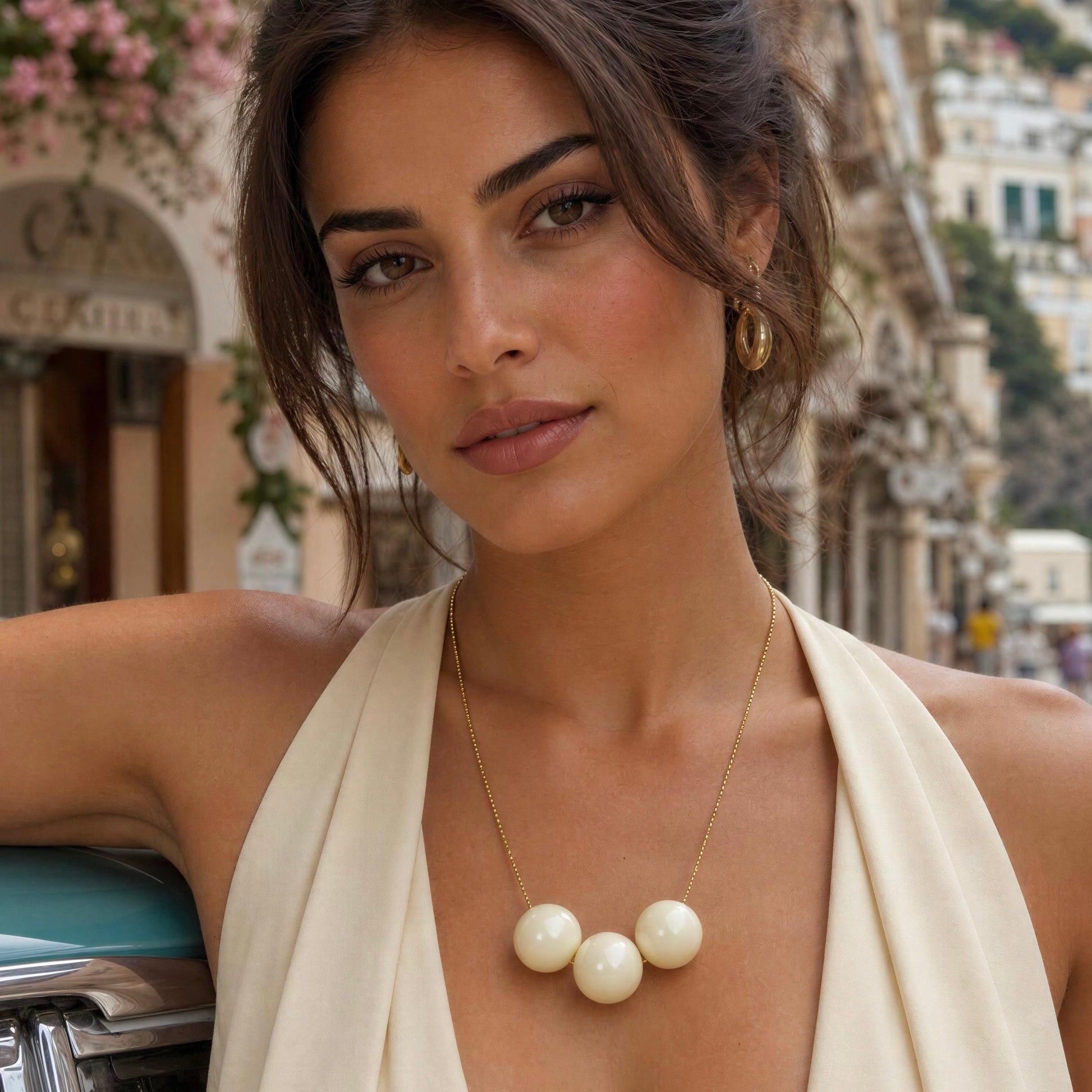 Woman wearing the Calla necklace in an outdoor setting