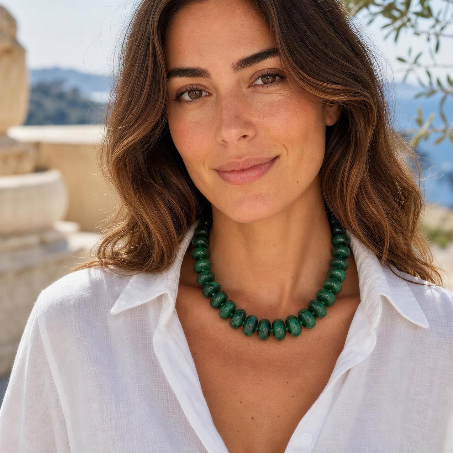 Woman wearing the Capri Verde Statement Choker with a scenic background