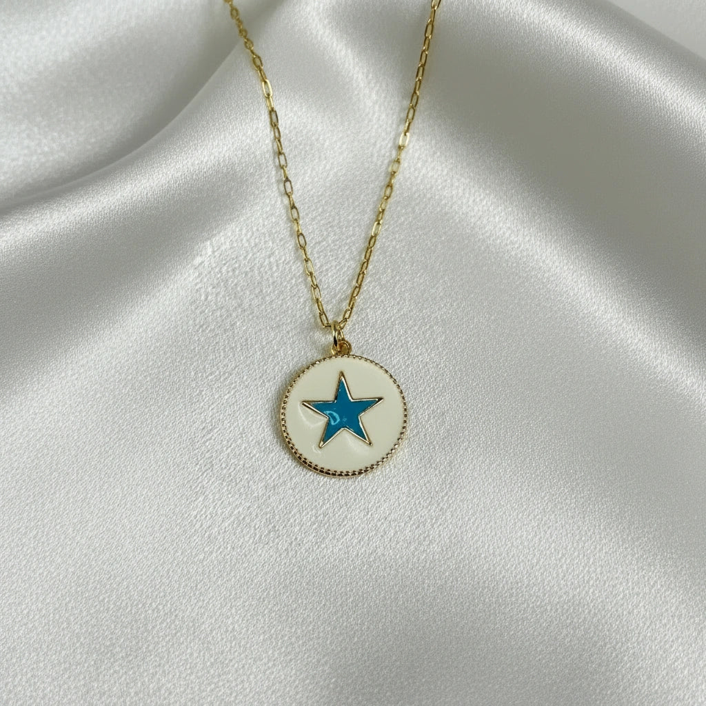 Celestia Turquoise Star Necklace with a star pendant on a white fabric background