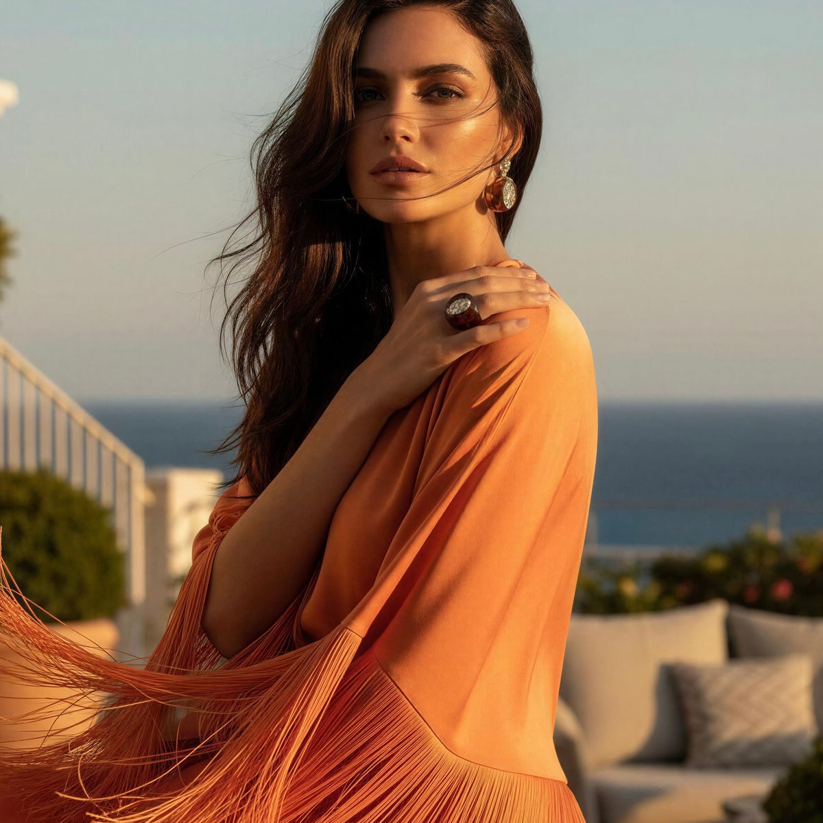Model wearing a modern orange fringes dress and the Lola_Ring_Toffee fromnChica_Chica_Jewelry- Retro Glam Collection . 