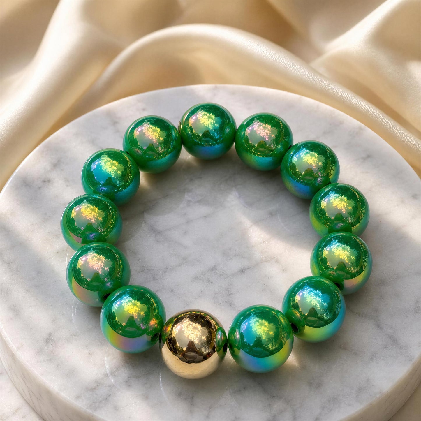 The Emerald Glow Bracelet on a marble surface