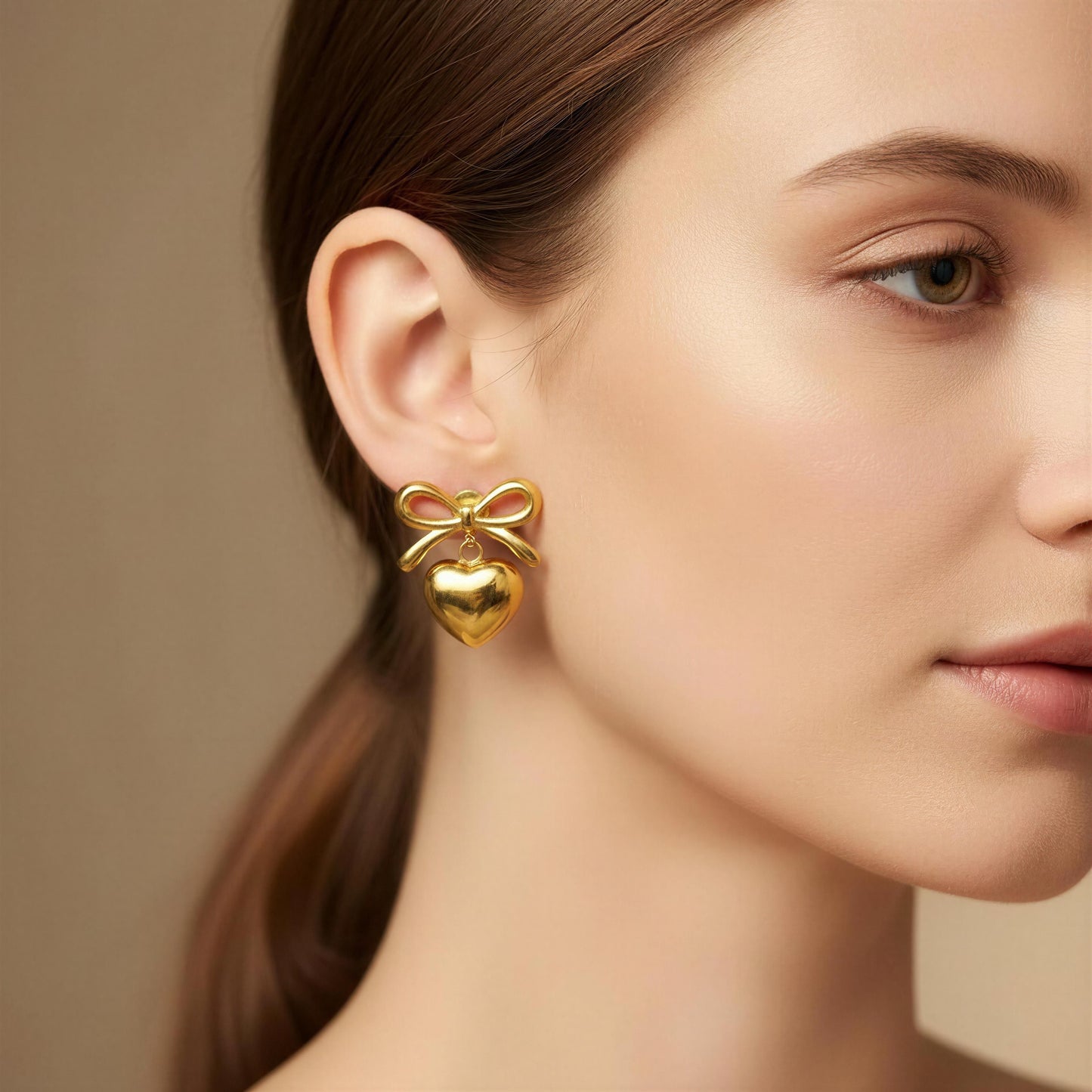 Model posing with the Cupid's Knot Earrings - Gold