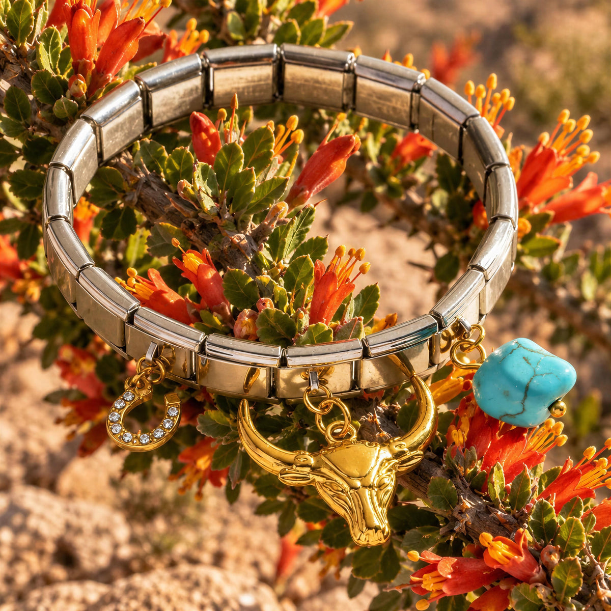 The Desert Spirit Bracelet from Chica Chica Jewelry on a desert scenery against orange desert flowers.