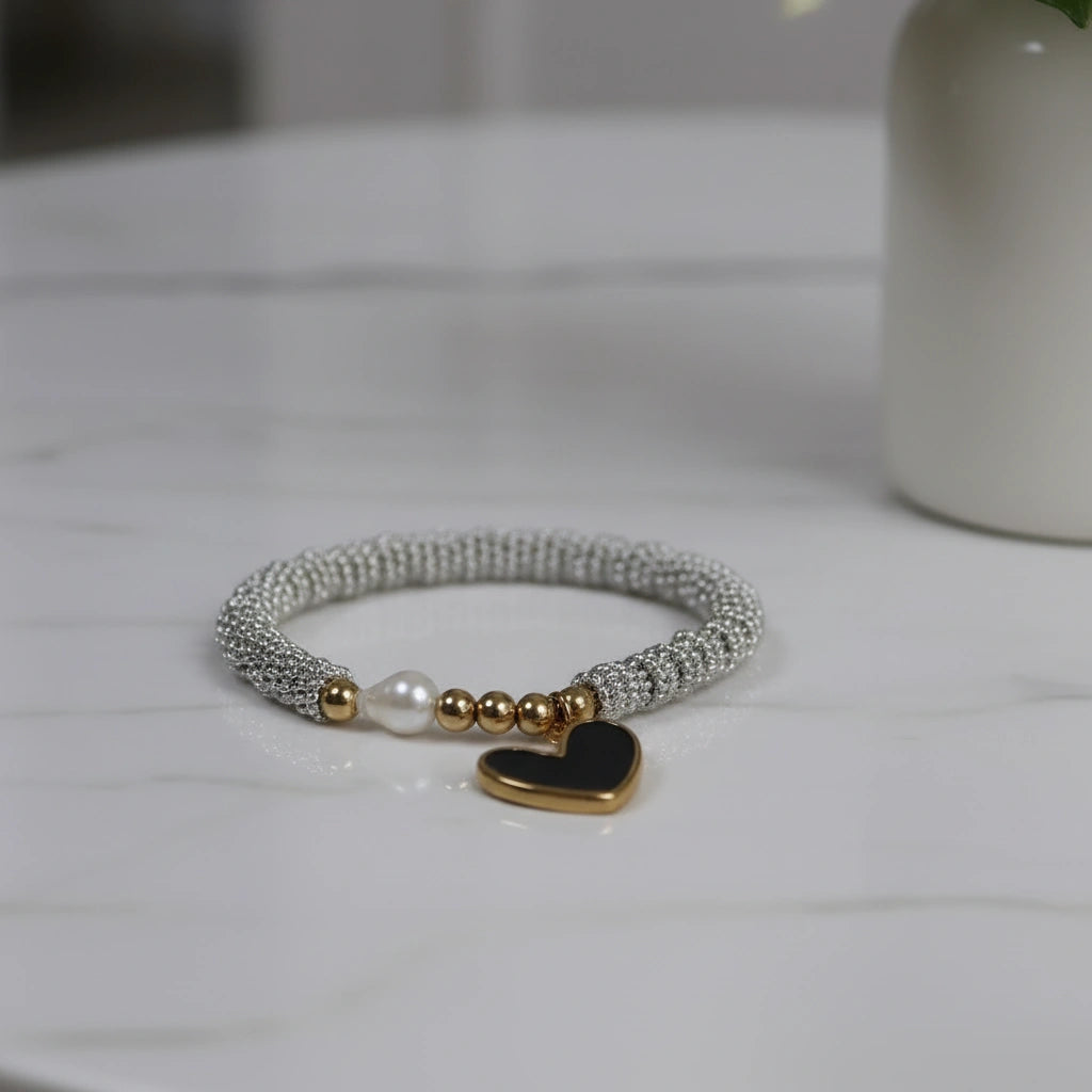 Flatlay of the Endless Promise Noir Heart Bracelet
