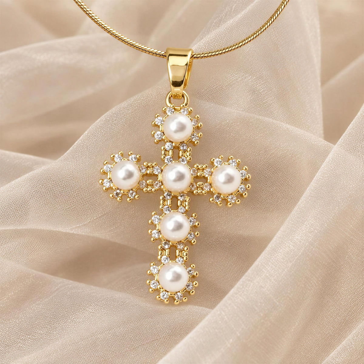 The Divine Grace Necklace from Chica Chica Jewelry against a cream organza fabric.