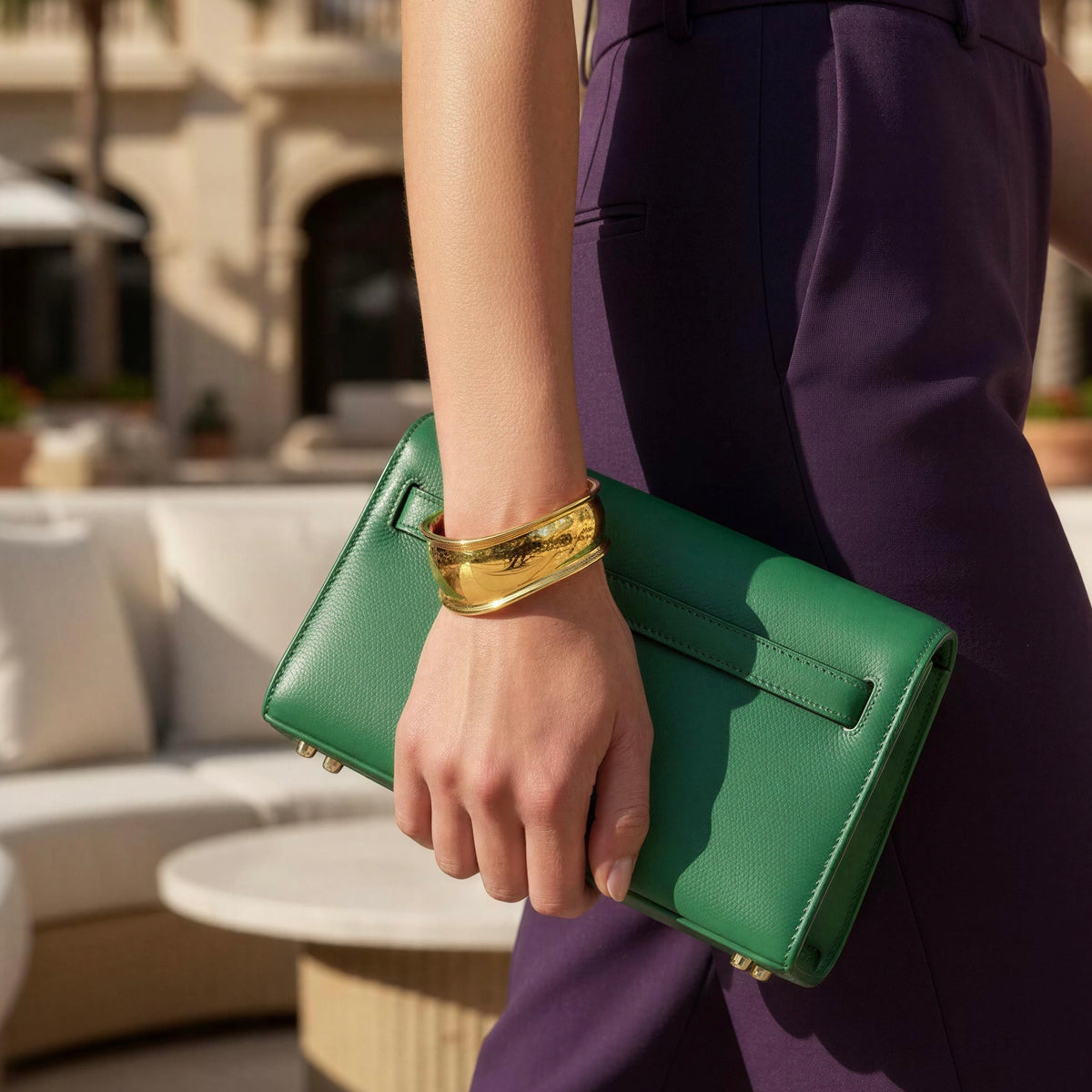 Forma Gold cuff bracelet styled with purple trousers and green handbag