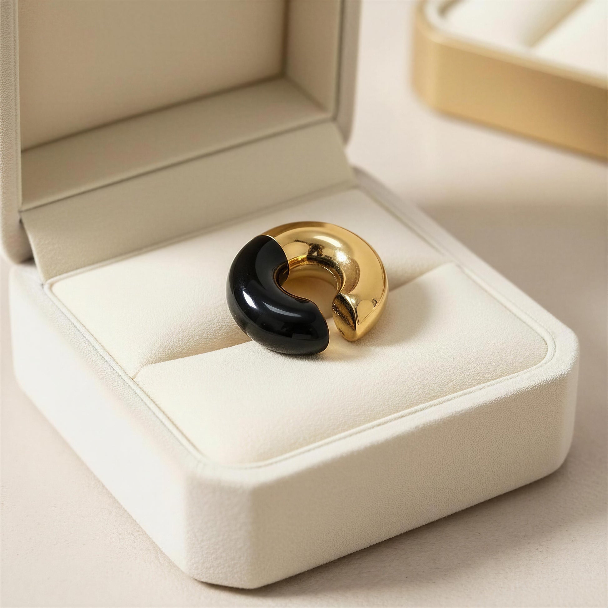 Gold and black ear cuff from Chica Chica Jewelry in a jewelry box