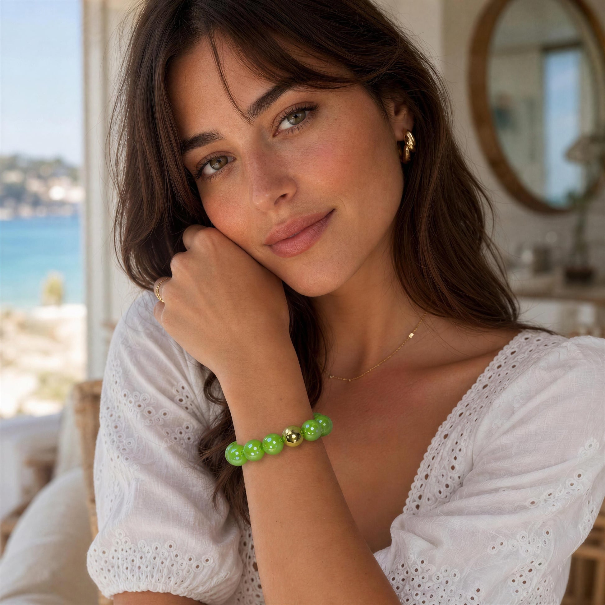 Woman wearing the Green Apple Bracelet with a scenic background
