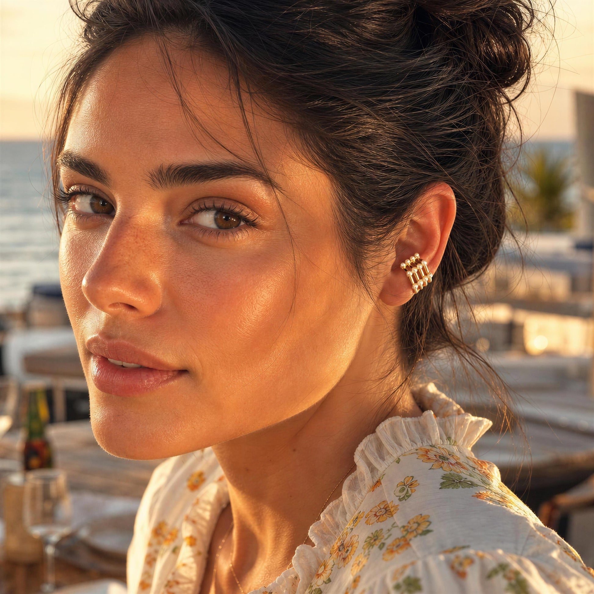 Woman wearing the Grid Pearl Ear Cuff featuring pearl accents and 18K gold-plated architectural detailing