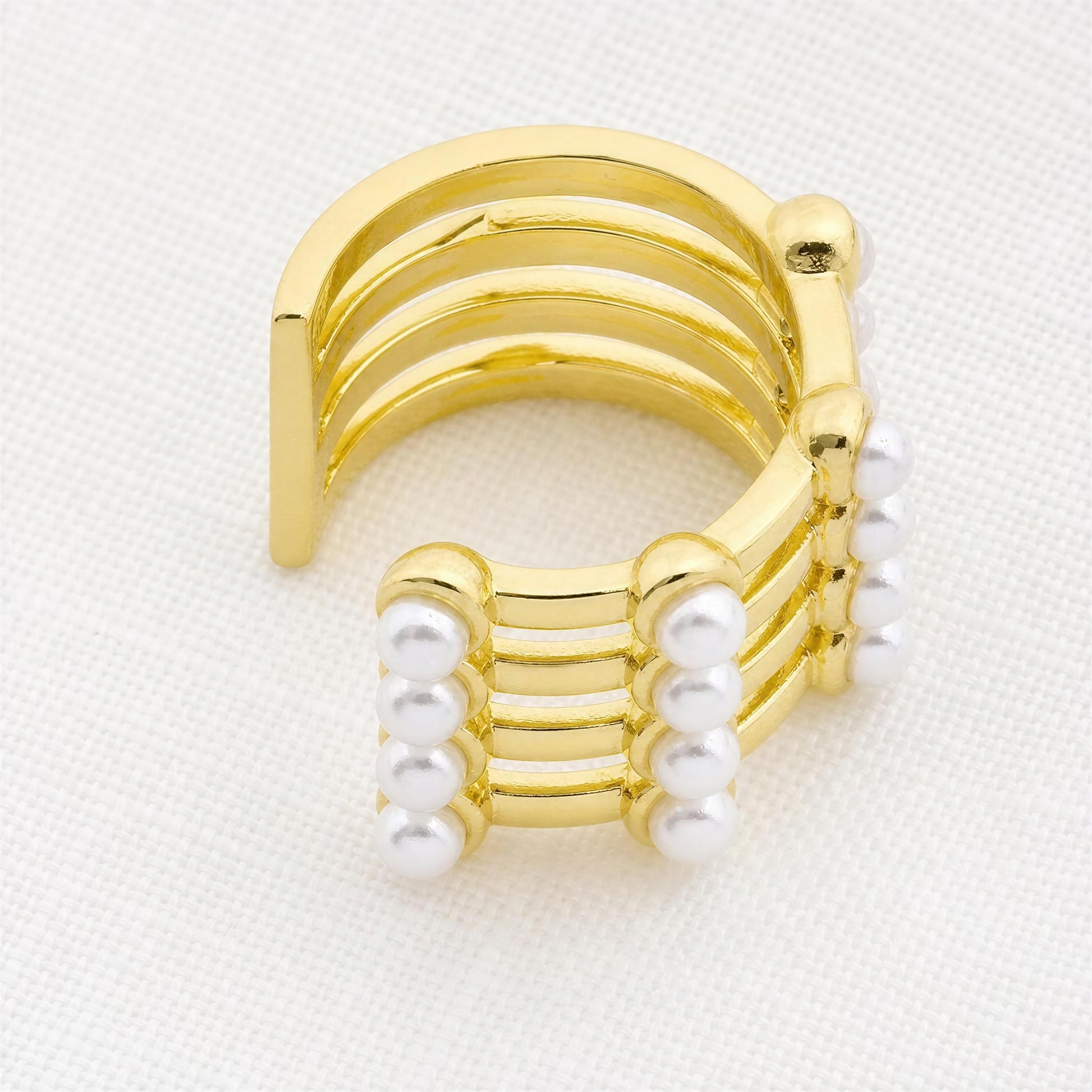 The Grid Pearl Ear Cuff featuring pearl accents and 18K gold-plated architectural detailing on a white background