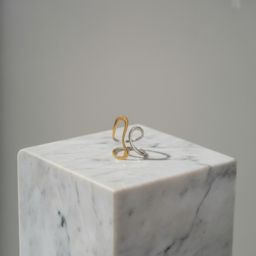 The Infinity Flow Ring on a marble cube with a gray background