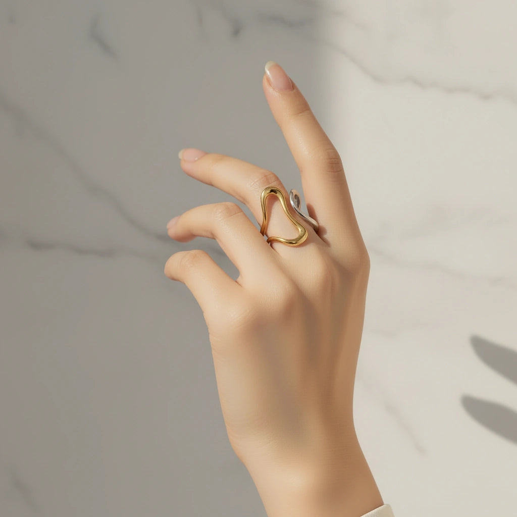 Hand wearing the Infinity Flow Ring on a neutral background