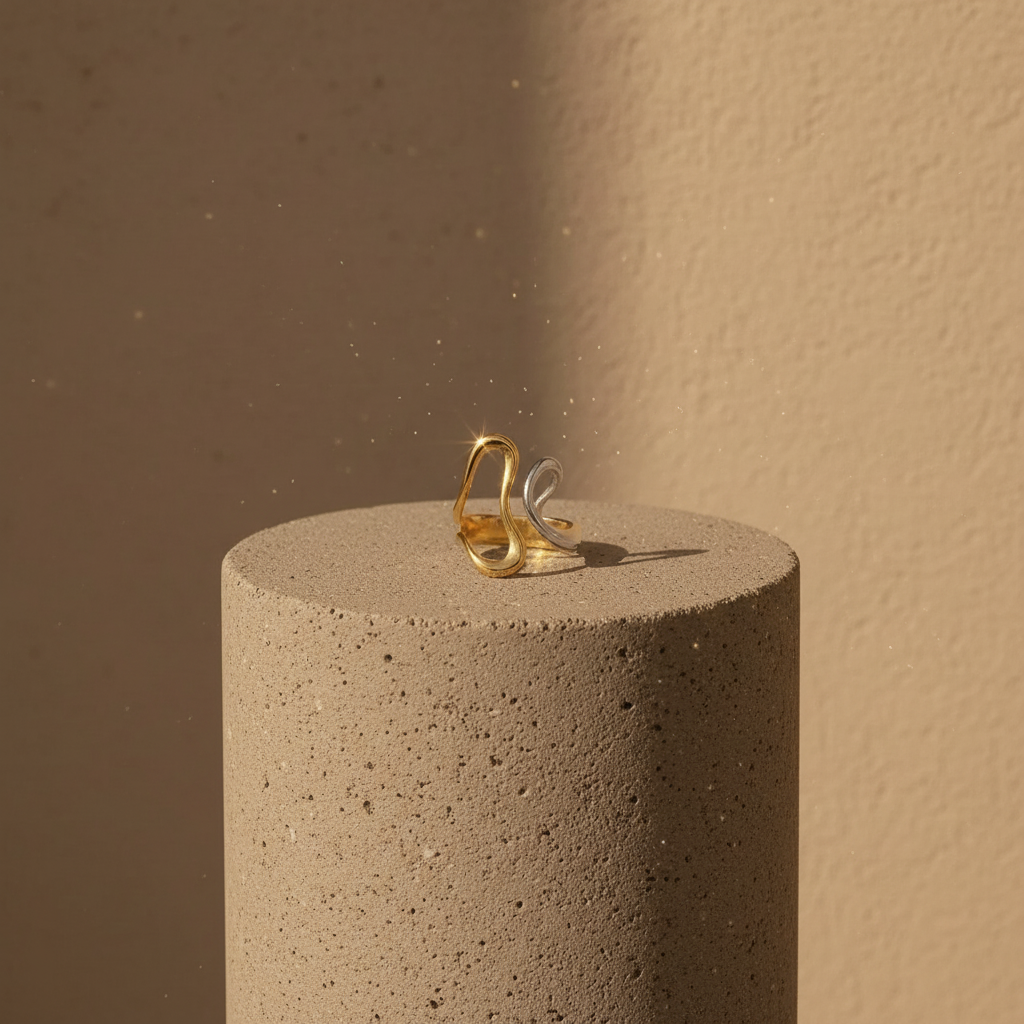 The Infinity Flow Ring on a textured brown surface with a soft brown background