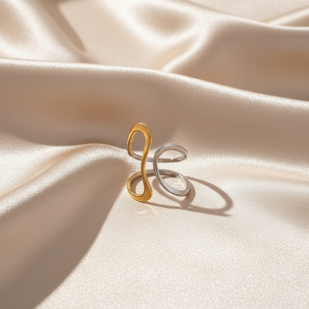 The Infinity Flow Ring on a beige fabric background