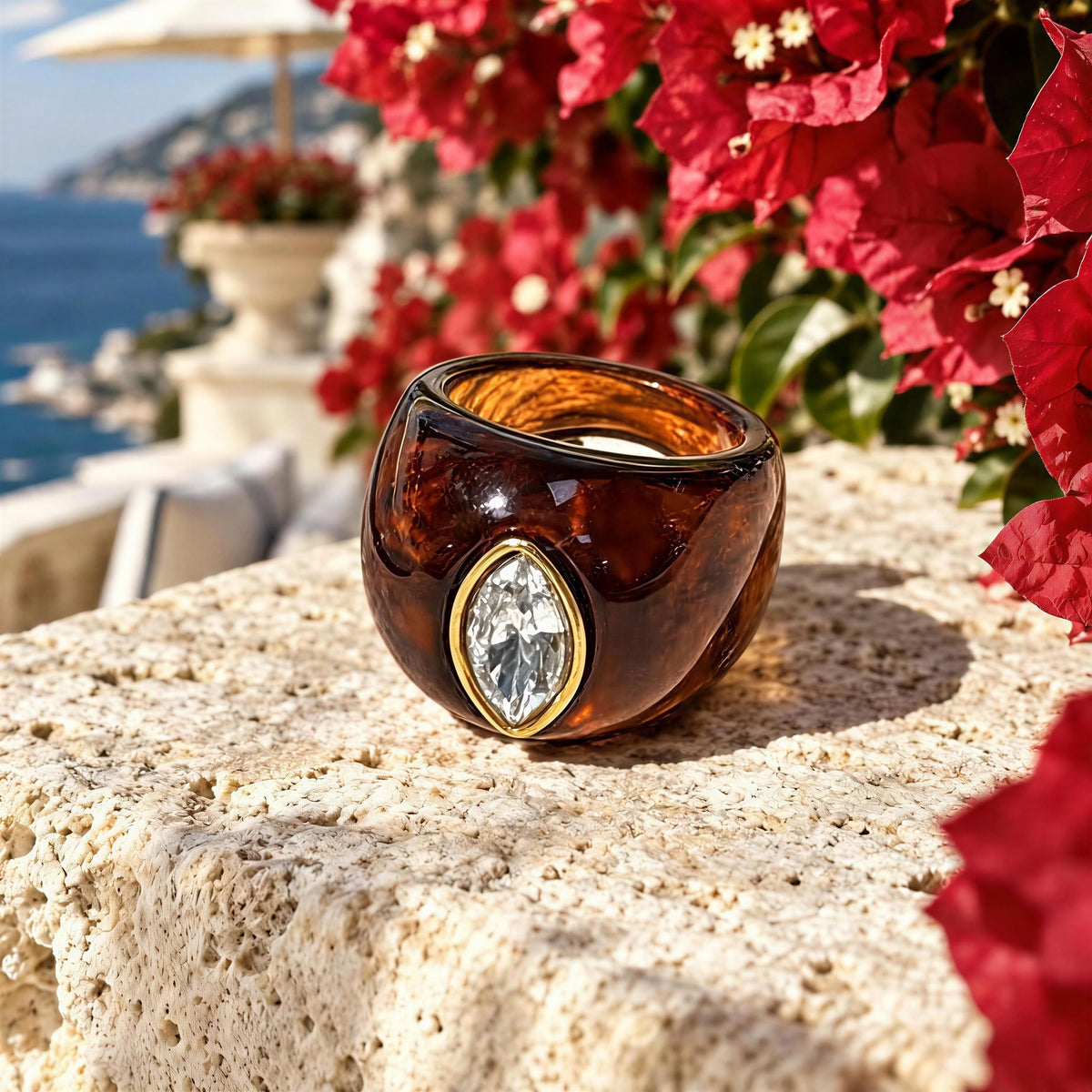 The Lola_Ring_Toffee-_Chica_Chica_Jewelry- Retro Glam Collection set outdoors by bougainvillea. 