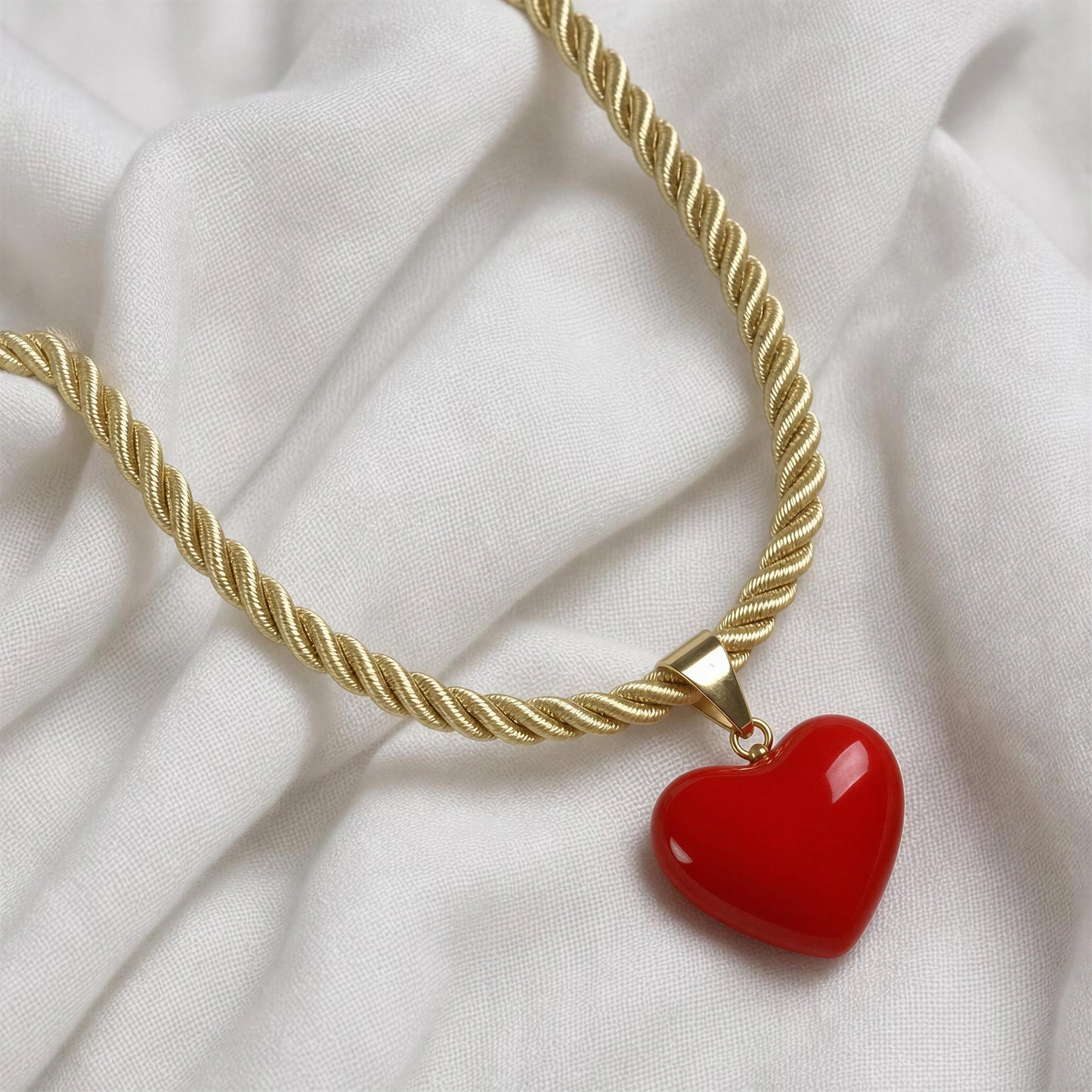 The Corallo Necklace against white linen fabric