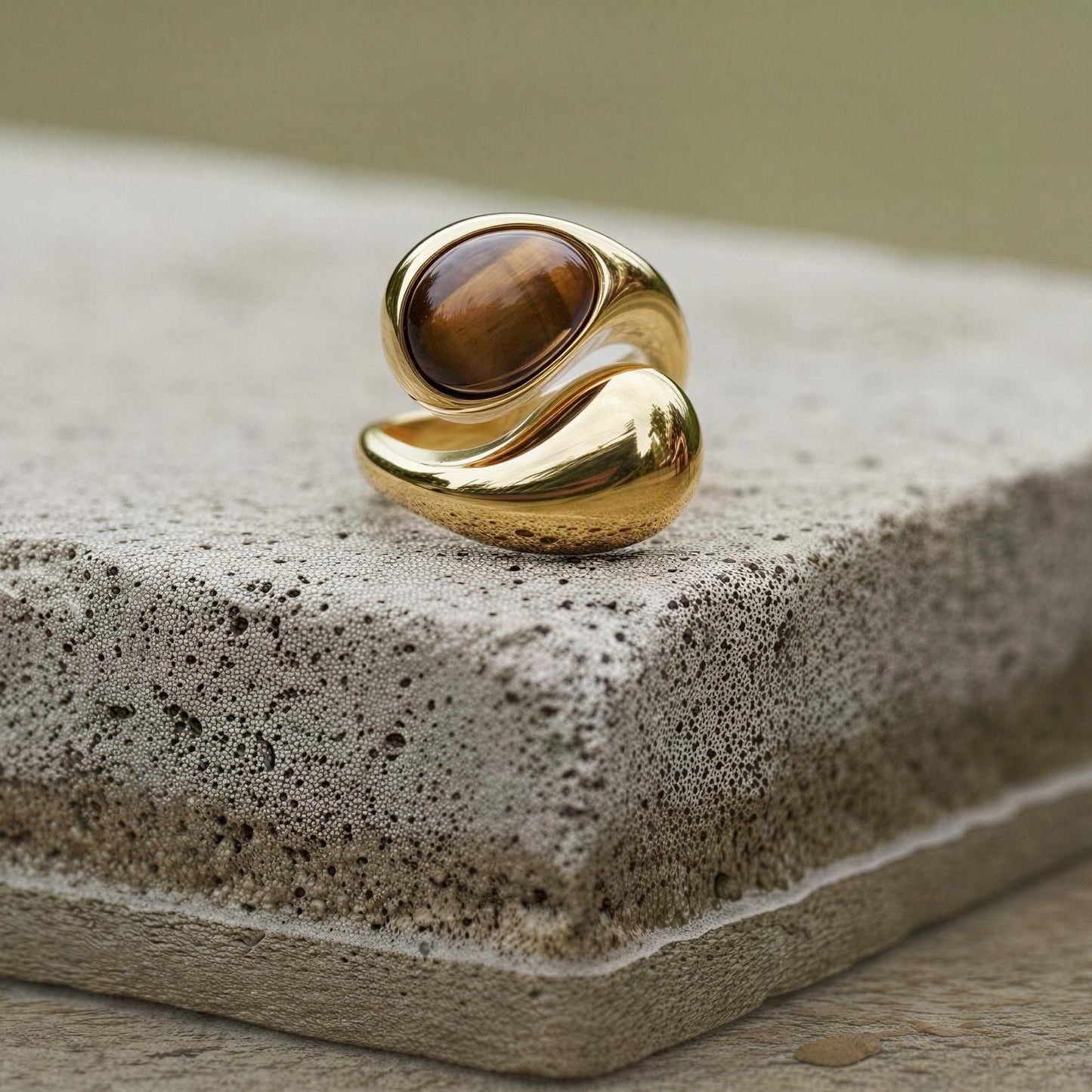 The Molten Terra Ring  on a concrete surface