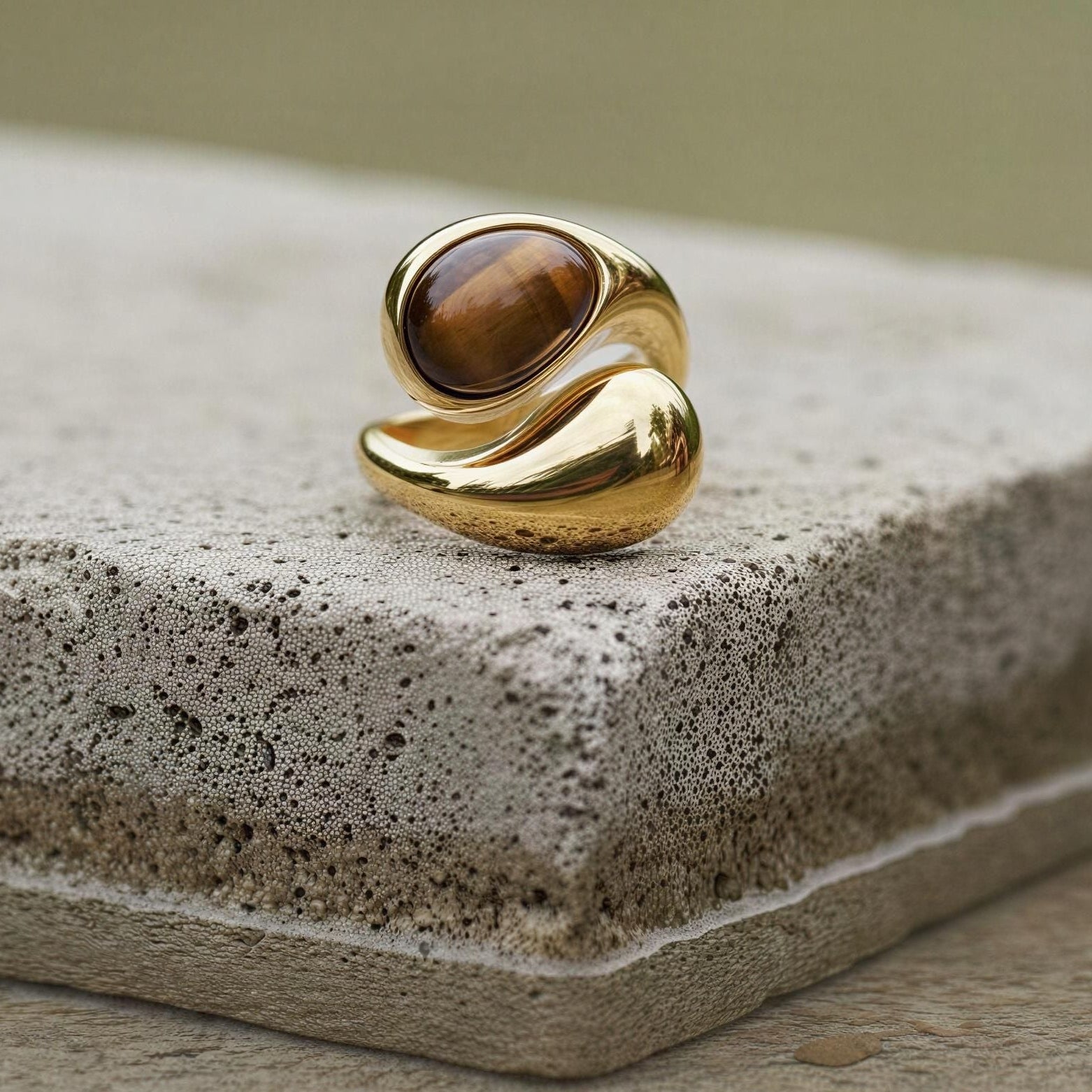 The Molten Terra Ring  on a concrete surface