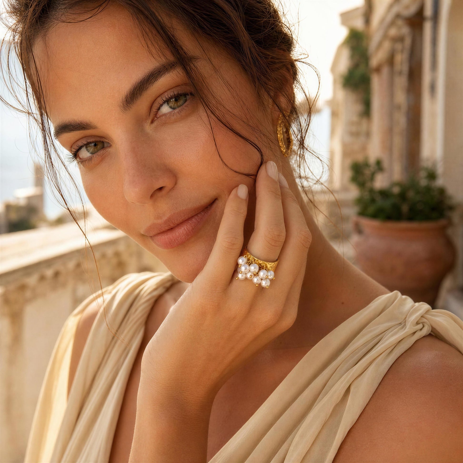 Model wearing the Ocean Pearl Bloom Ring at coastal terrace 