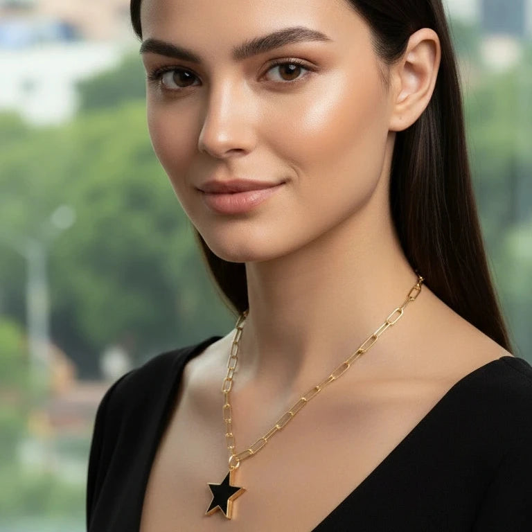 Woman wearing the Radiant Noir Star Necklace - star pendant outdoors
