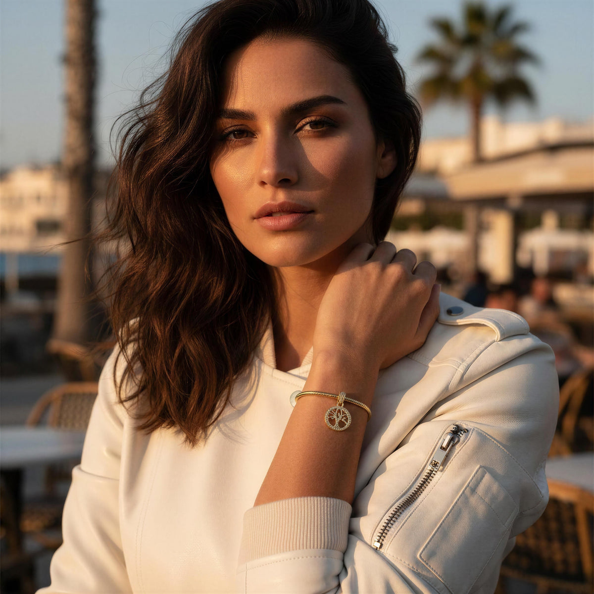 Model wearing the Renata gold Tree of Life charm bracelet by Chica Chica Jewelry.