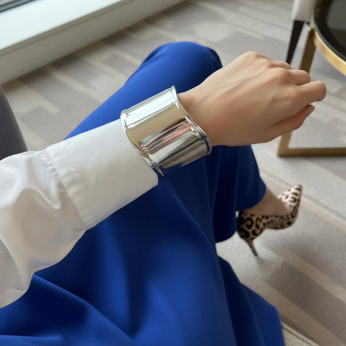 Model wearing a blue silk skirt and the Roma Cuff from Chica Chica Jewelry. 