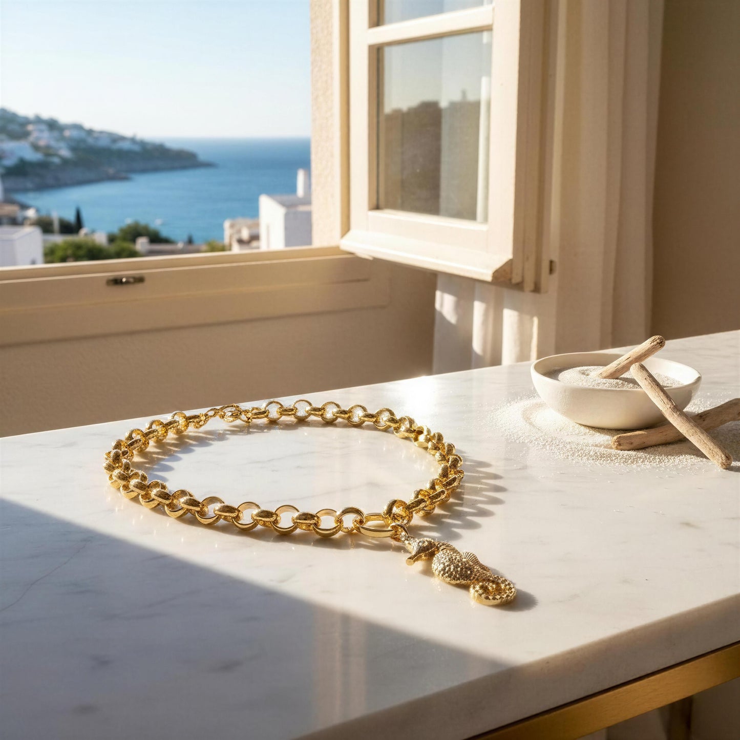 The Seahorse Statement Necklace on a marble surface with a scenic view through a window.