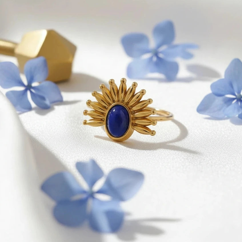 The Solara Ring against white with blue flowers 