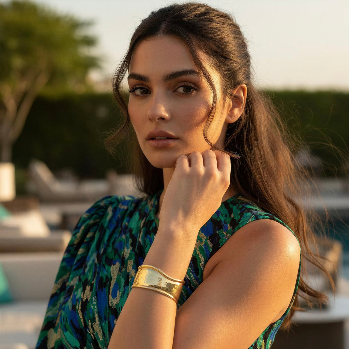 Forma Gold cuff bracelet styled with elegant green patterned outfit
