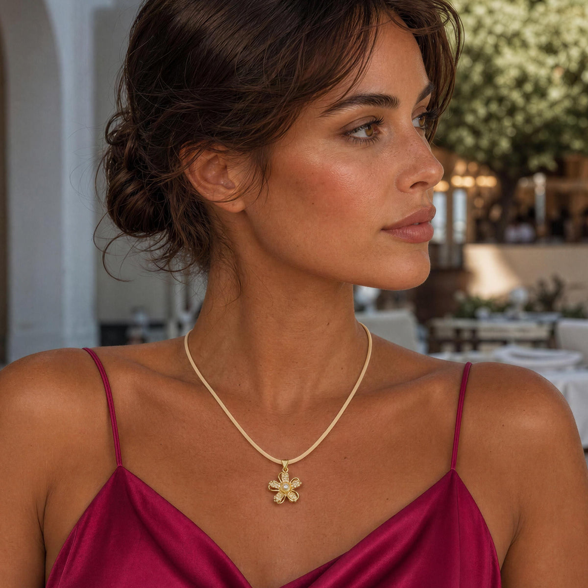 The Camellia Necklace from  Chica Chica Jewelry worn by model in a raspberry silk straps dress. 