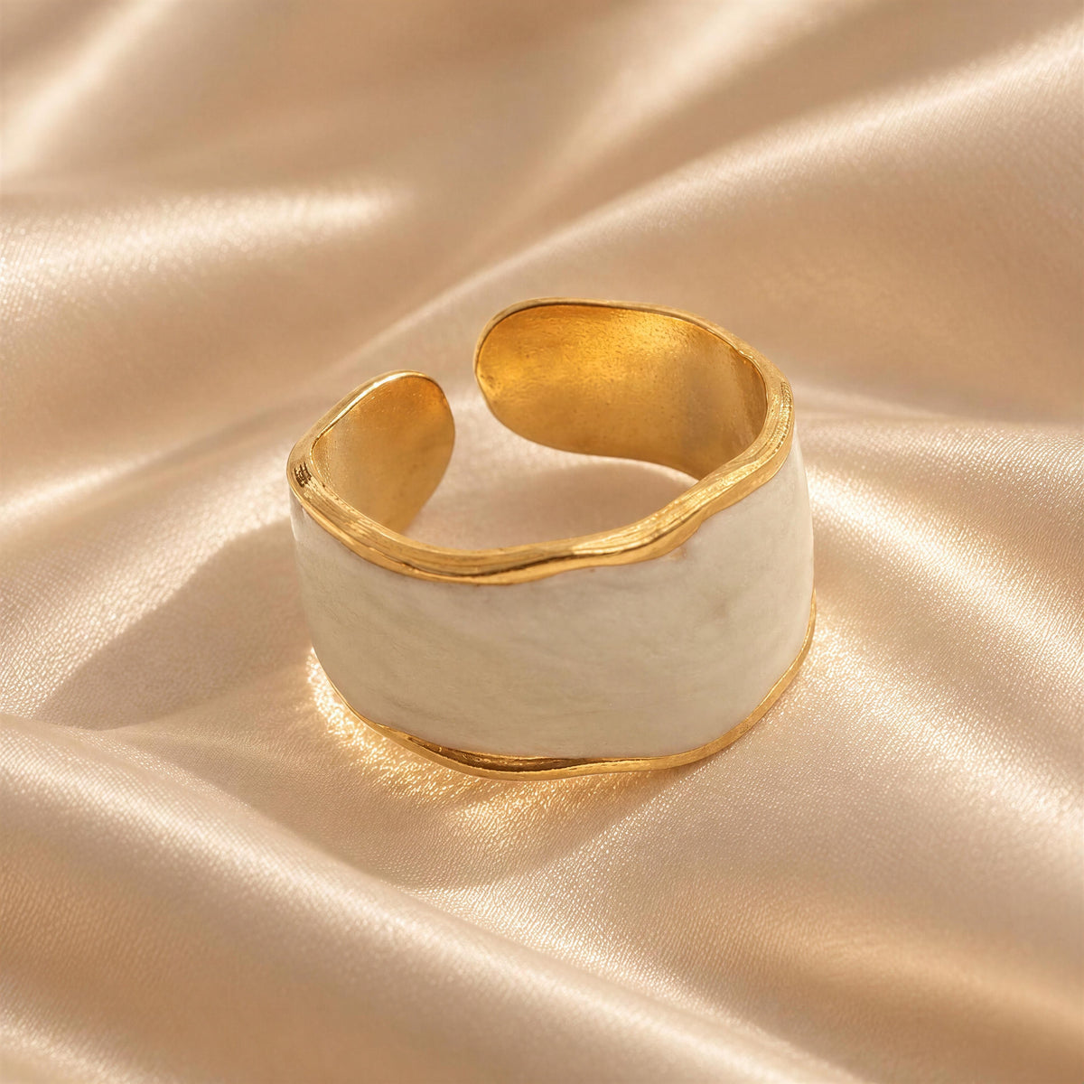 The Duna_Ring_Alabastro- Retro Glam Collection from ‘Chica_Chica_Jewelry against crème ivory silk fabric. 