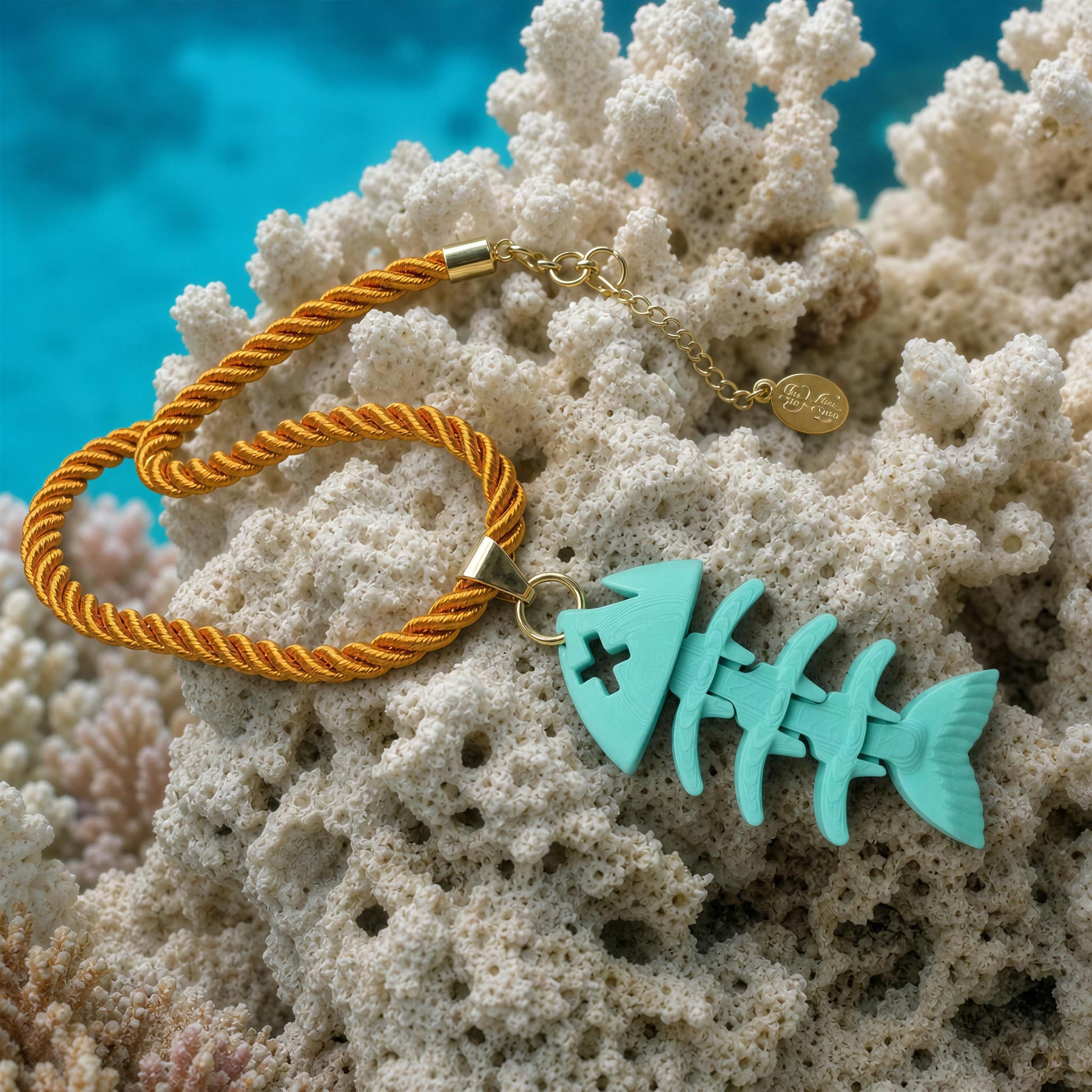  The Lisca Fishbone Necklace from Chica Chica Jewelry by ocean coral reef. 
