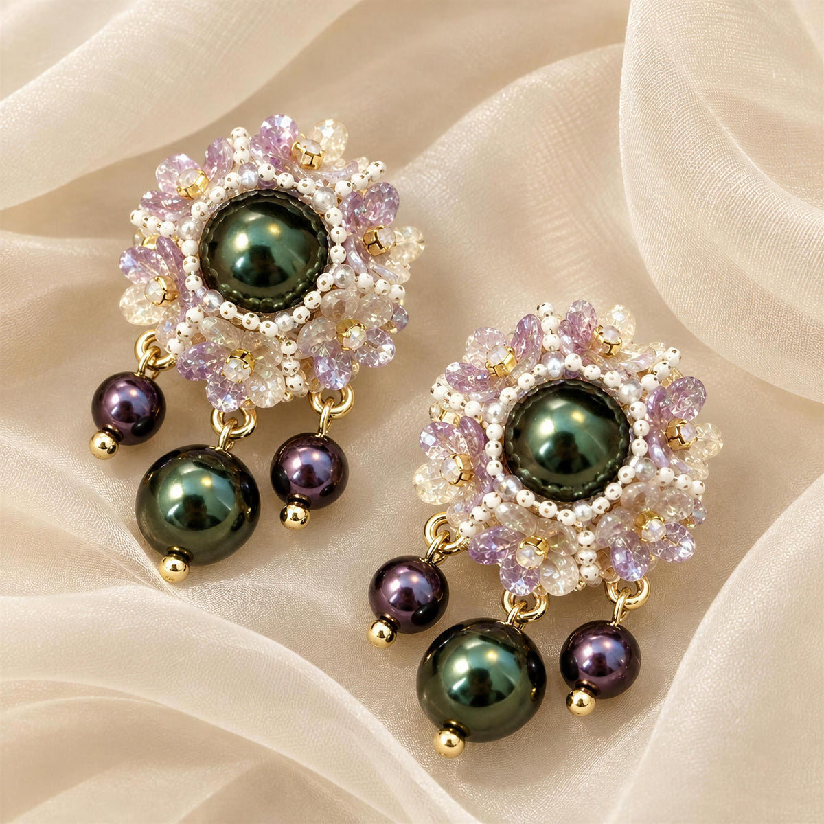 The Paloma Earrings - Chica Chica Jewelry against an organza crème color fabric.