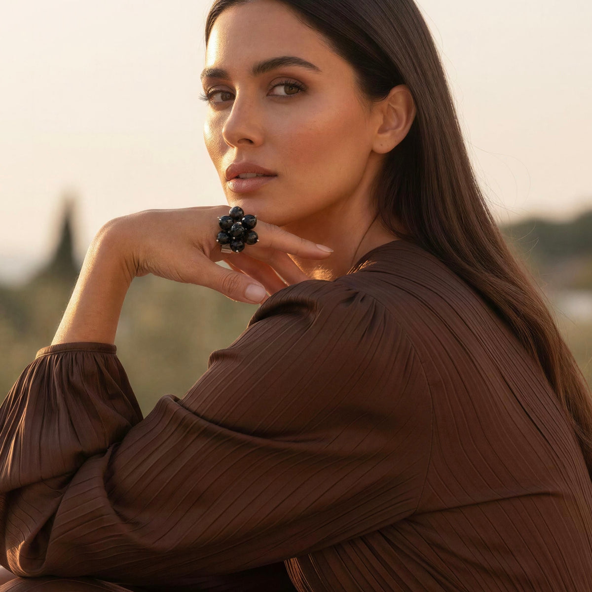 Model wearing a chocolate silk dress and the Sabina Ring from Chica Chica Jewelry 