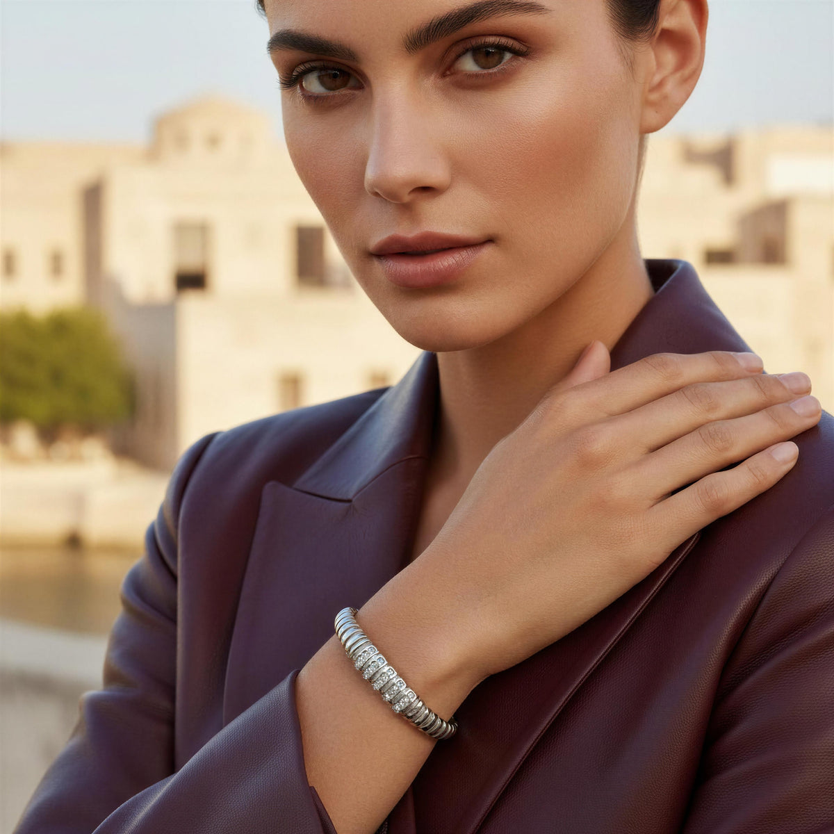 Model wearing a burgundy leather jacket and the Alessia Bangle from Chica Chica Jewelry 